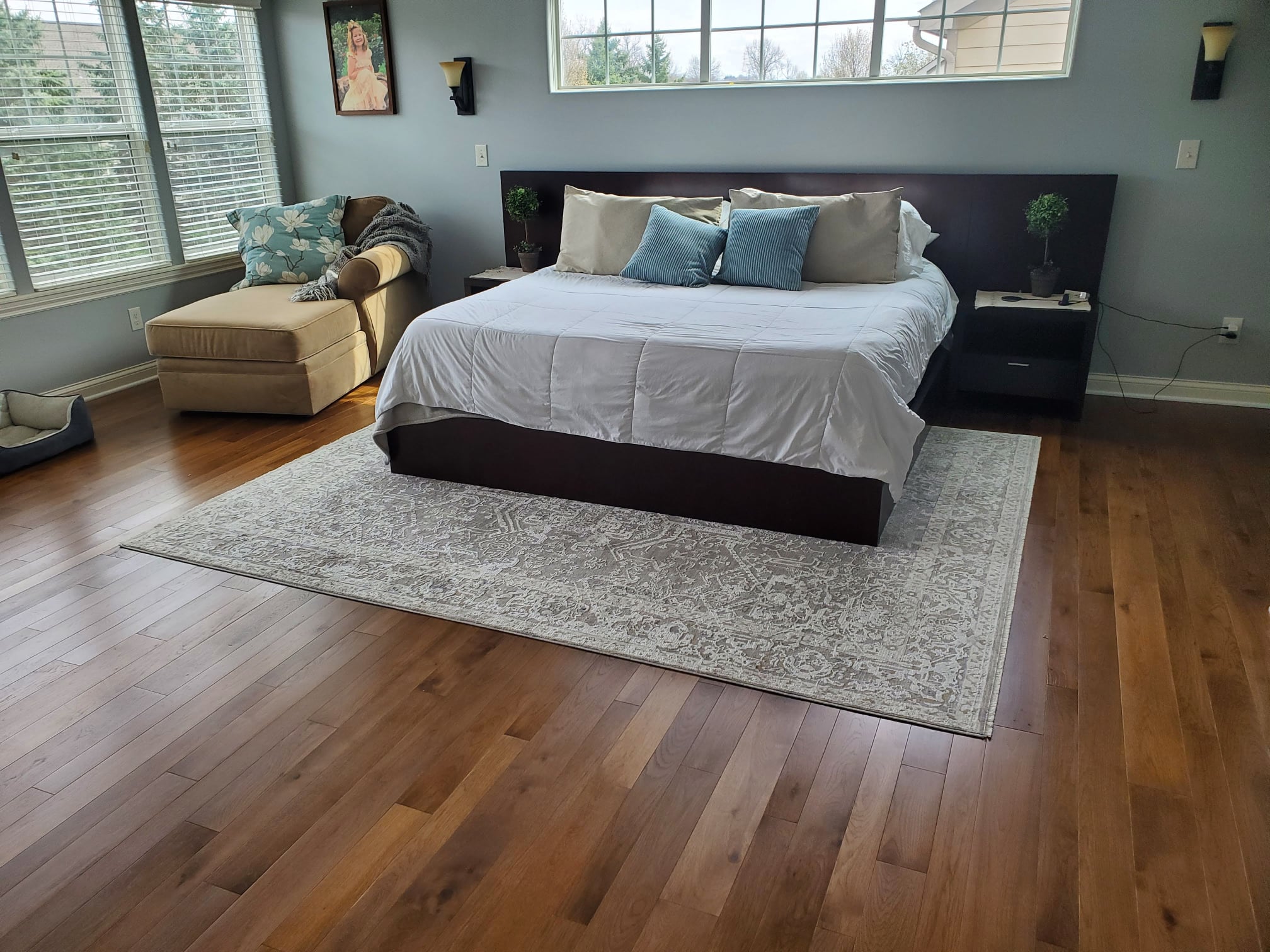 Yoder Custom Hardwood Character Collection solid Hickory Well-lit master bedroom with solid hickory hardwood floors from Yoder Floors.