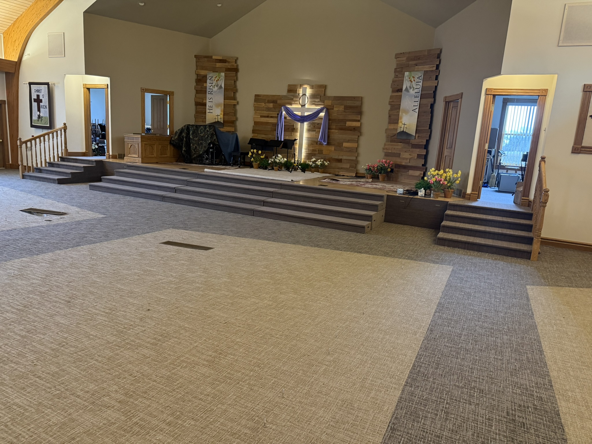 Shiloh Church 5 Church sanctuary with low-pile, stain-resistant commercial patterned carpet by Shaw Contract. It enhances acoustics and durable for high traffic areas.