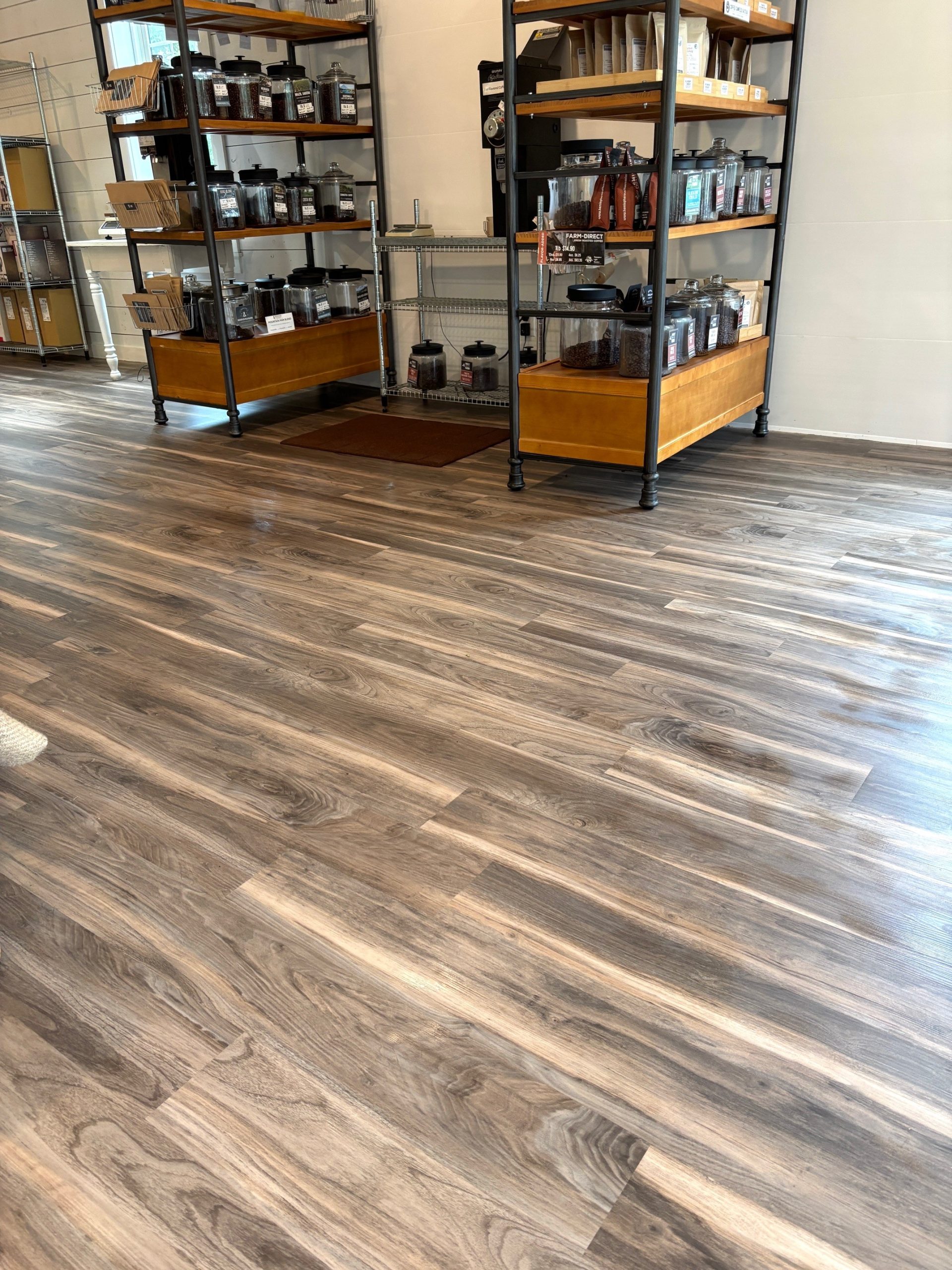 Hemisphere Coffee Roasters retail space featuring wood-look Luxury Vinyl Plank (LVP) from Yoder Floors.